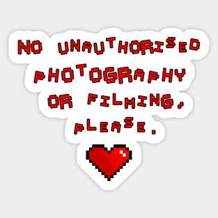 No unauthorised photography or filming, please. Sticker